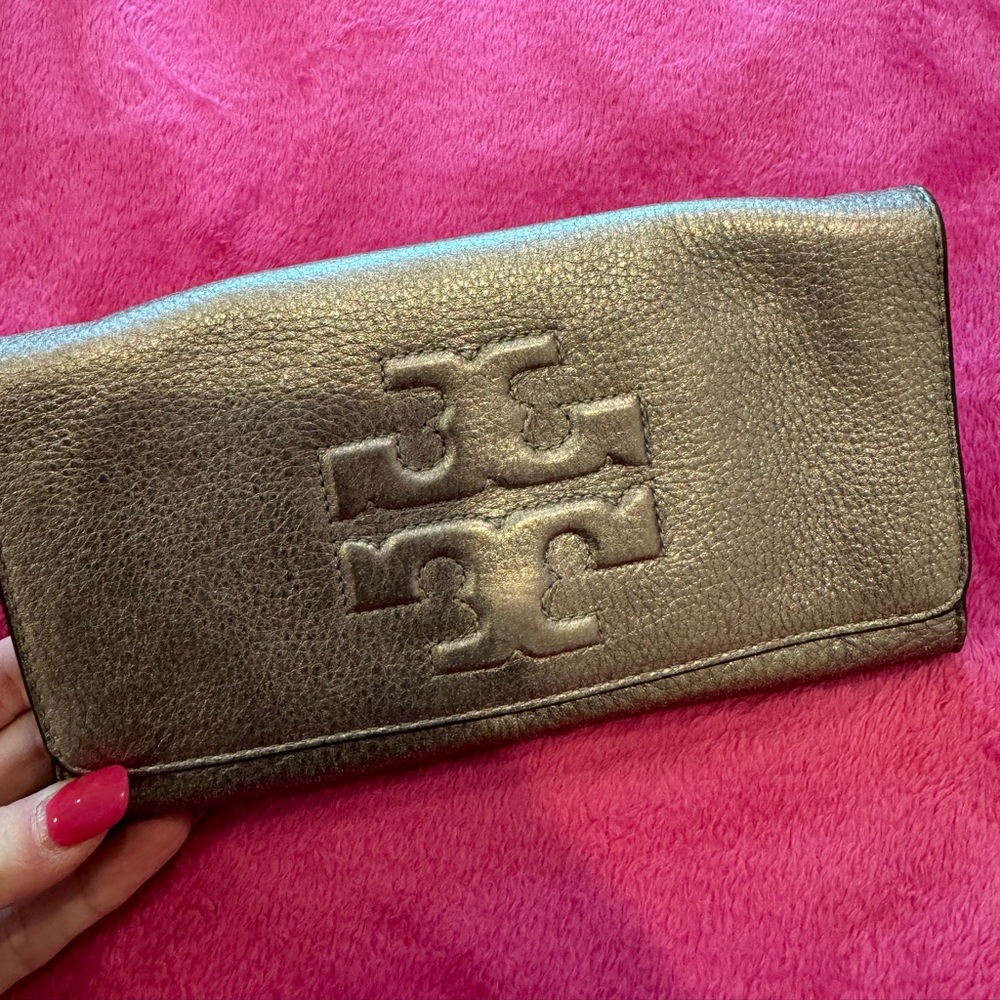 Tory Burch metallic foldover clutch. “Like New condition”